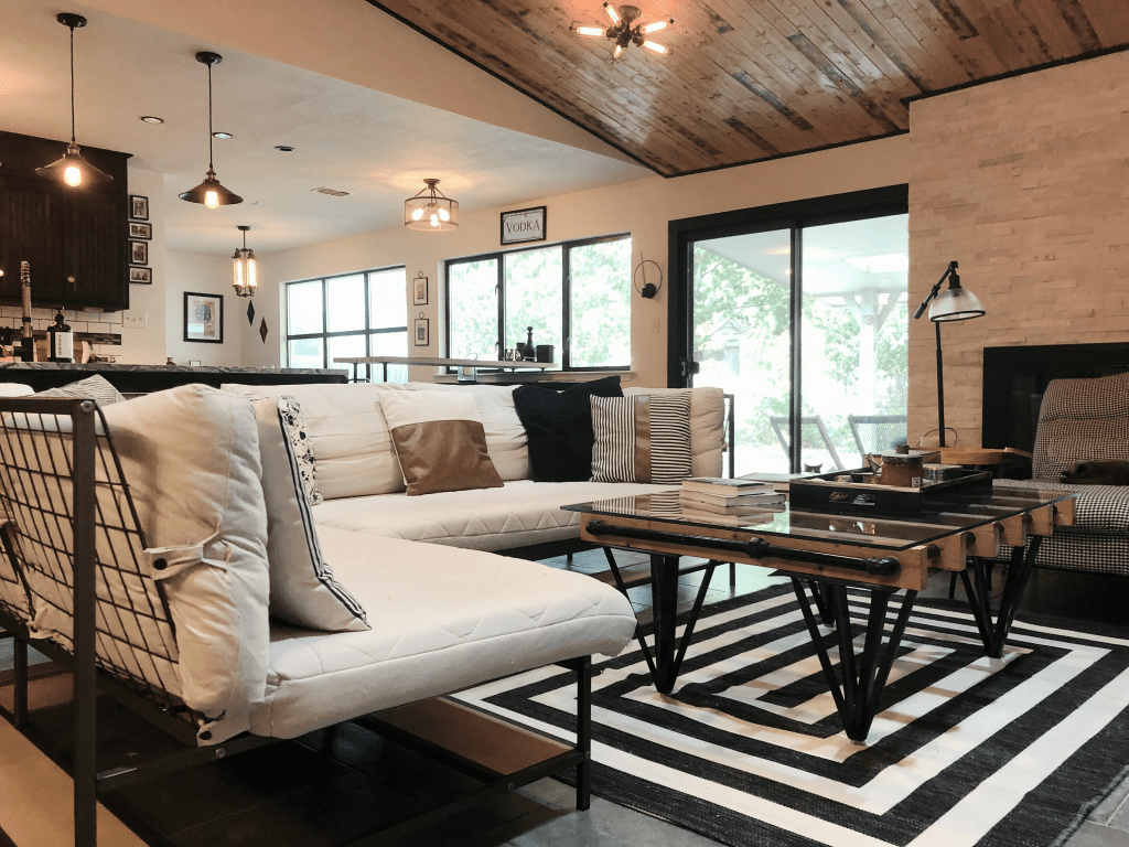 My upscale industrial living room after I redesigned it and did a DIY home renovation on a budget  Bringing elevated loft style to the suburbs